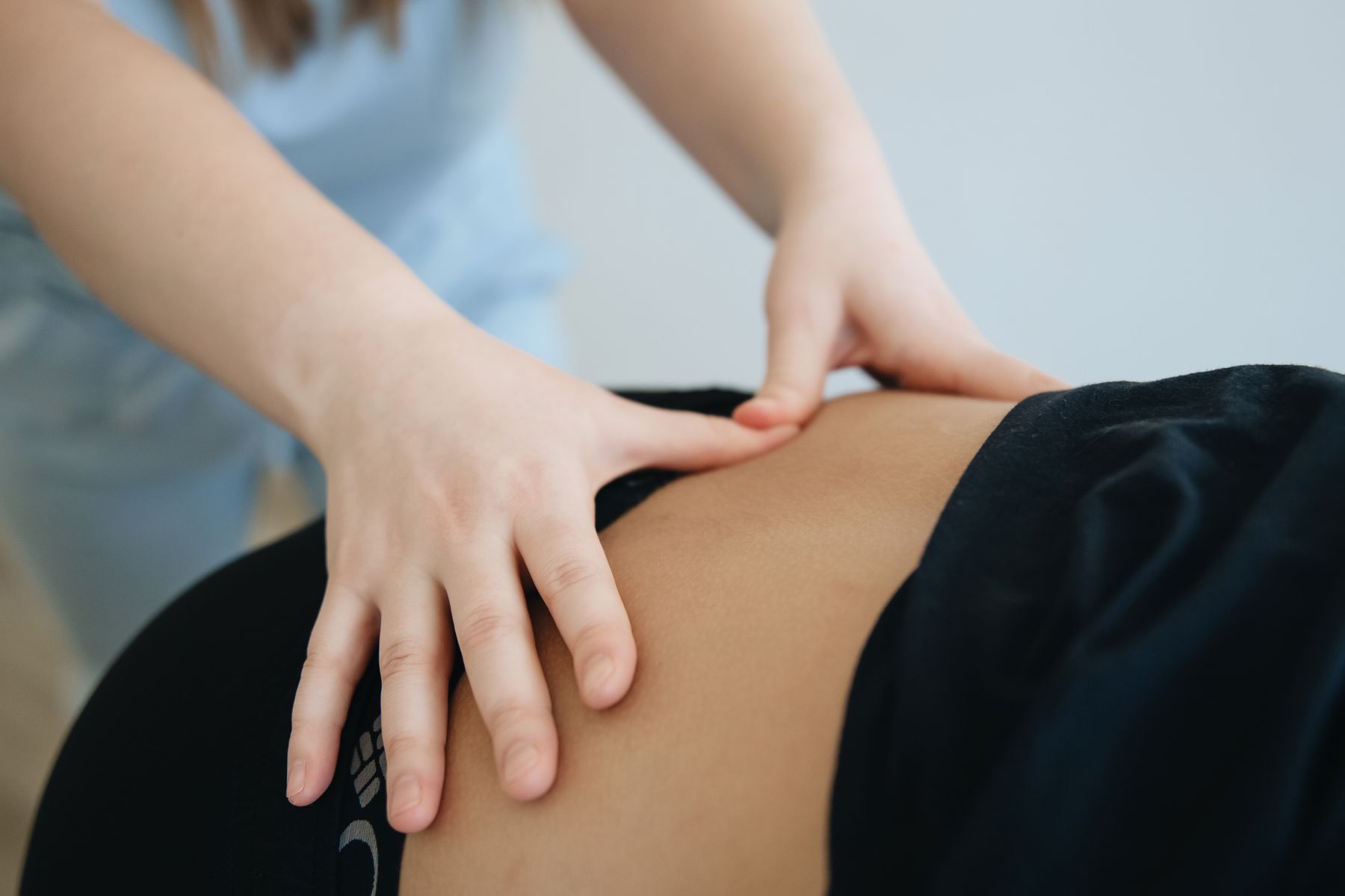 Therapist treating a patient's lower back